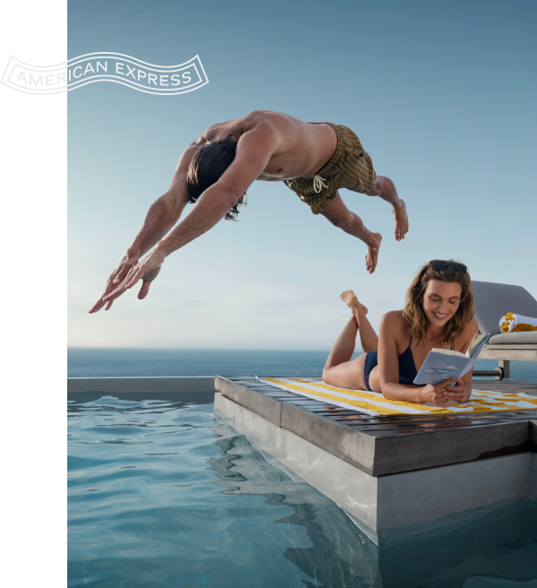 man jumping to the pool