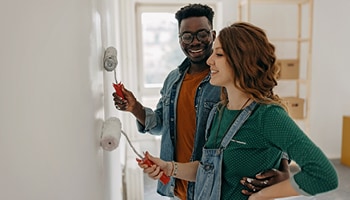 Two people renovating their house. 