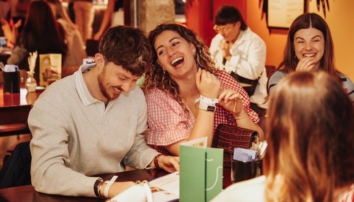 A group of people enjoying food and drinks at the London Restaurant Festival