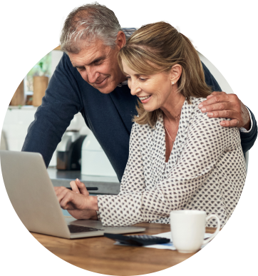 Married Couple Looking at their Account on their Laptop
