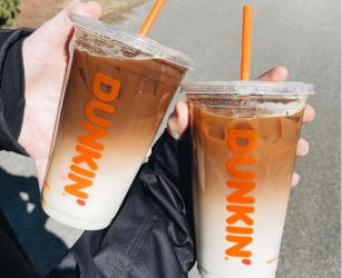 Hand holding a red Dunkin Refresher