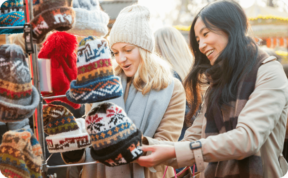 People looking at hats