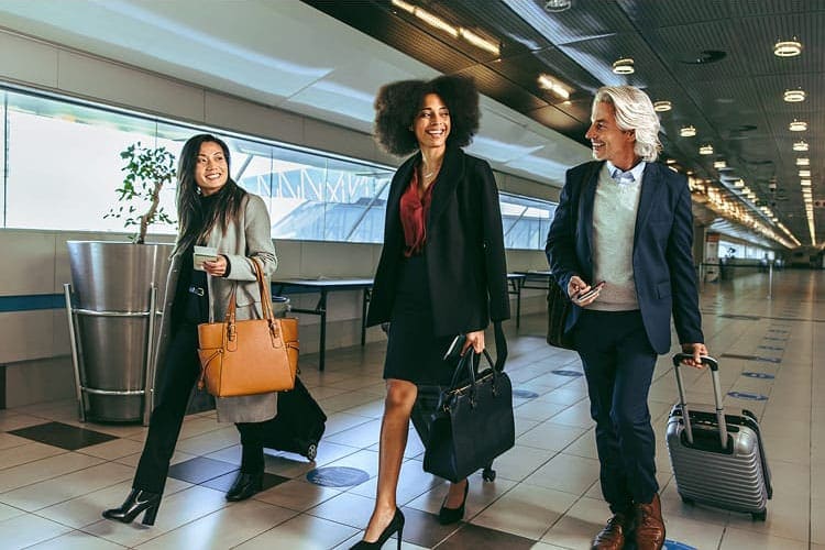 People in business attire in an airport