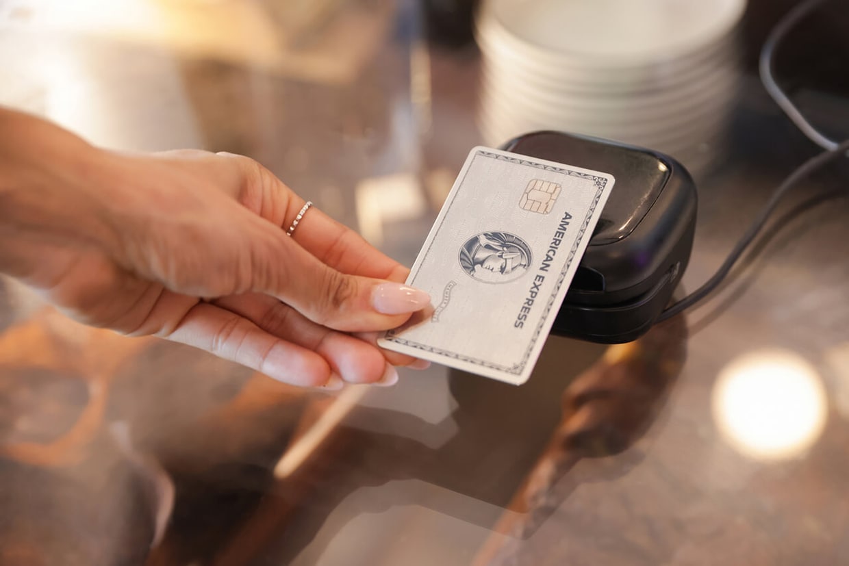 A person tracking a credit card at a card reader