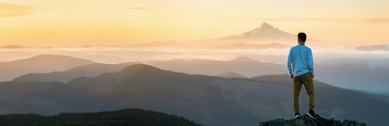 Person looking over the mountains