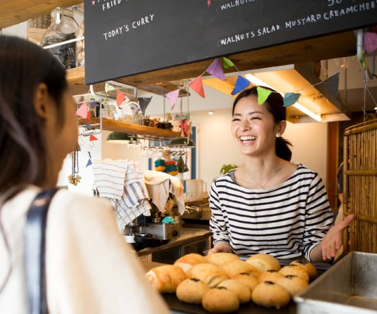 Small Businesses - Florist working on arrangement.”