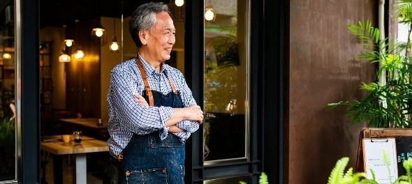 Restaurant owner ready to greet customers