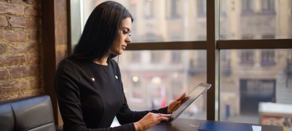 Woman reading on a tablet device